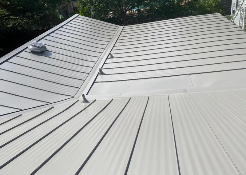 Solar attic fan installed on a metal roof for Roof Ventilation in Pasadena Hills
